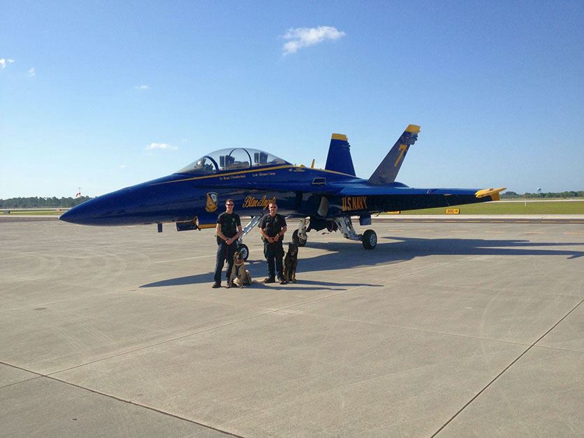 K-9 Officers with Navy Jet